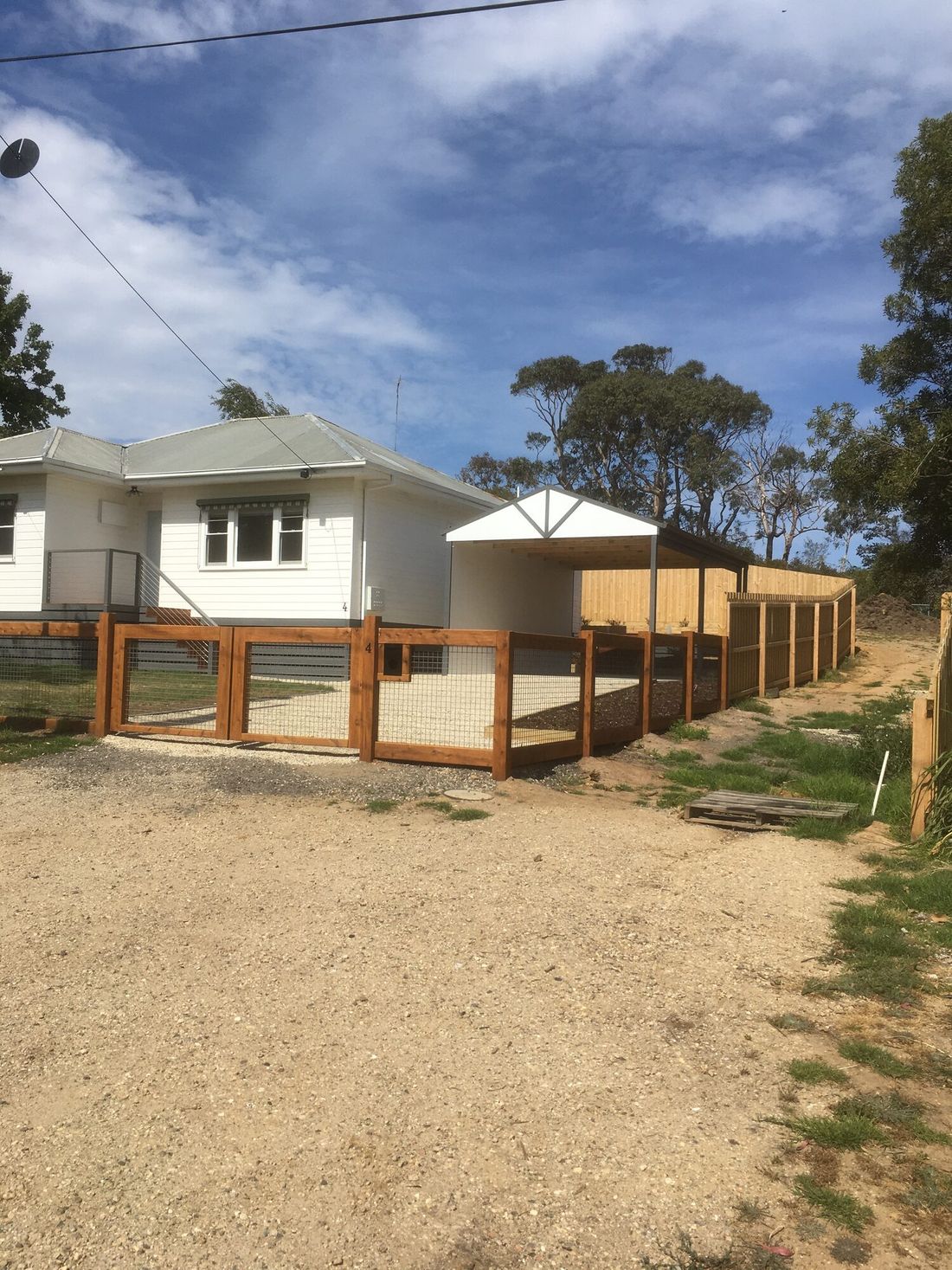 Wire mesh panel with oiled cypress framing